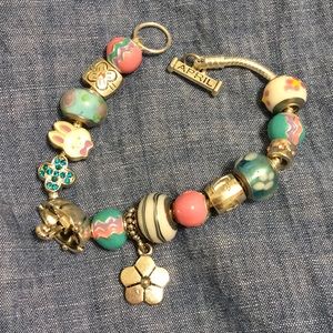 Silver tone spring charm bracelet